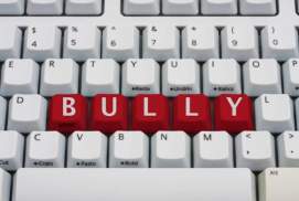 Keyboard with bully spelled in red letters