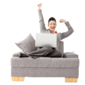 Woman on couch telecommuting on laptop